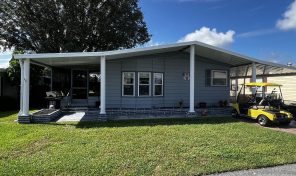 Partially furnished home with a golf cart in Swiss Golf & Tennis